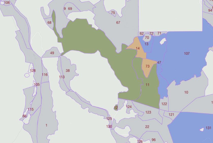 Map showing various numbered land parcels, with a large green area in the center.